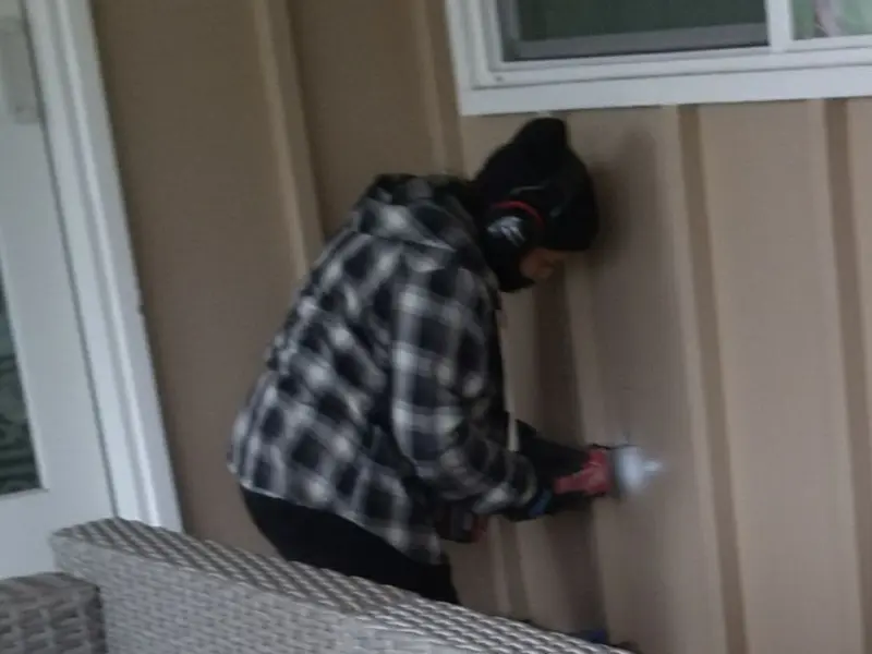 Professional electrician installing an exterior outlet in Slidell