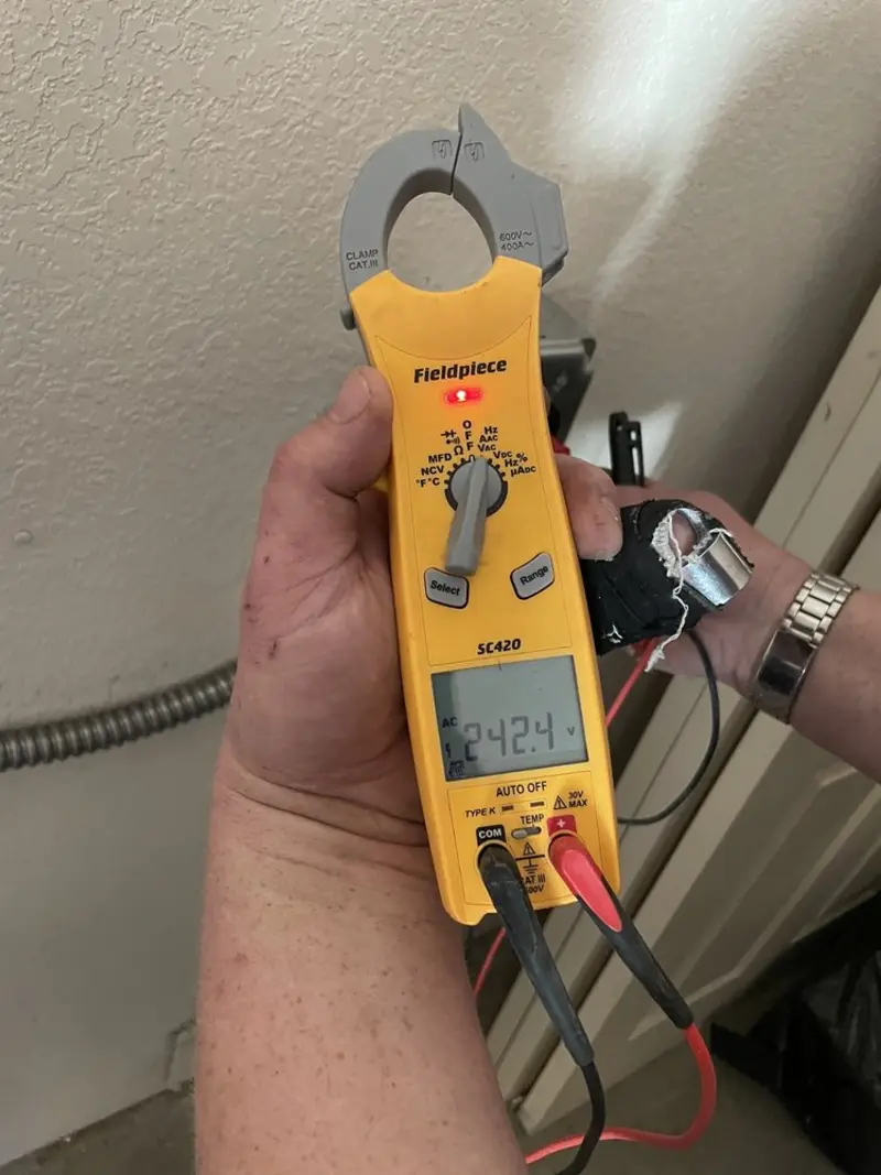 Voltage testing with clamp meter during Recessed Lighting Installation in Slidell